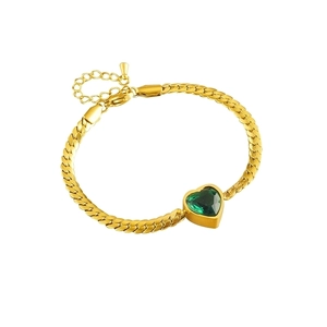Gold snake chain bracelet featuring a green heart gemstone pendant on a white background