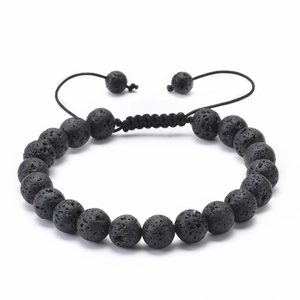 Detail of adjustable black lava stone beaded bracelet with handcrafted braided cord