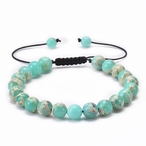 Detailed close-up of natural turquoise stone beads and adjustable black woven cord