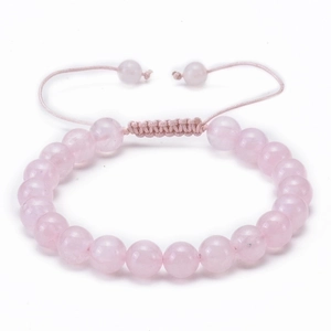 Detail of hand-woven pink natural stone bead bracelet with adjustable cord closure