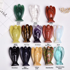 Detailed view of thirteen carved natural crystal and gemstone angel figurines set