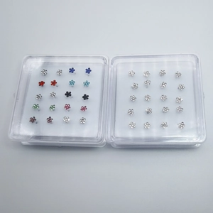 Detailed set of 20 925 sterling silver flower nose studs with colorful crystals in a box