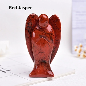 Macro detail of hand-carved Red Jasper angel figurine with natural stone textures