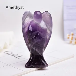 Detailed close-up of a natural amethyst angel carving with deep purple crystal texture