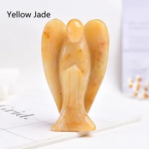 Detailed view of hand-carved natural yellow jade angel statue with spiritual stone texture