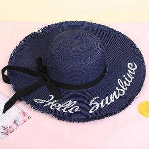 Navy blue wide brim straw sun hat with Hello Sunshine embroidery and black ribbon bow