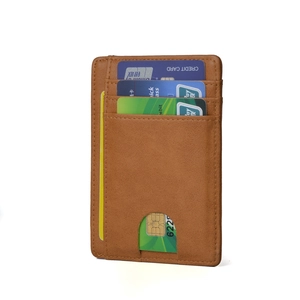 Slim tan RFID leather card holder with multiple stacked slots and fine precision stitching