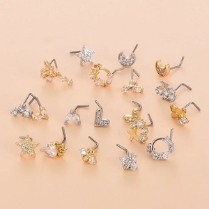 17-piece stainless steel nose stud set with gold and silver butterfly and star designs