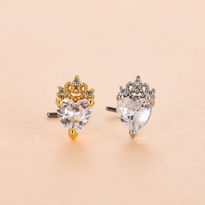 Detail view of heart-shaped zircon nose studs with crown design in gold and silver finish