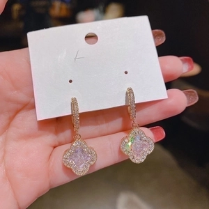 Macro view of S925 silver post flower earrings with cubic zirconia in rose gold finish