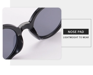 Close-up of the integrated nose pad on black round sunglasses for lightweight comfort