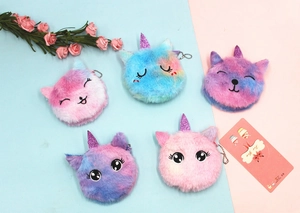 Detailed view of plush unicorn coin purses with sequins and colorful tie-dye fur textures