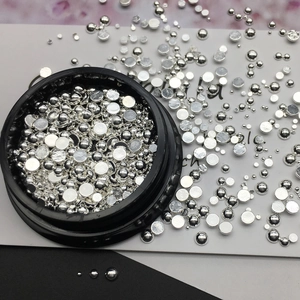 Silver metallic nail art studs with hollow round and rice shapes in professional box