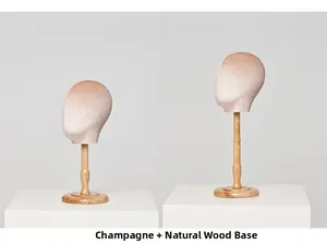 Detail of champagne velvet head mannequins with natural wood stands in two different heights