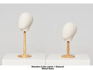 Detail view of linen fabric mannequin heads with natural wood base for hat and wig display