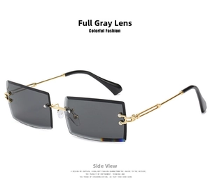 Detail view of rimless square sunglasses with grey lenses and gold chain temples