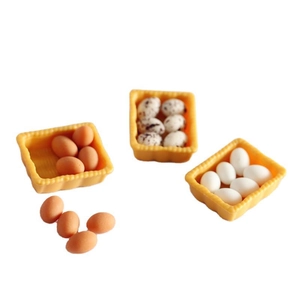 Miniature resin egg set in yellow baskets for dollhouse scenes with white and brown eggs
