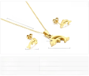 Detailed view of dolphin jewelry set with gold-plated stainless steel and white rhinestones