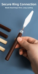 Detailed view of the reinforced steel ferrule connecting the wooden handle and palette knife
