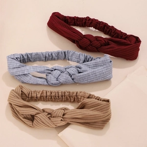 Three knitted twisted headbands in burgundy, grey, and khaki colors with elastic band