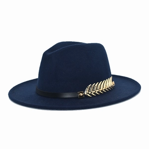 Detail of dark blue fedora hat with gold metal feather and black leather band