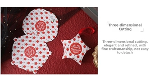 Flat lay of red and white Christmas star gift box with Merry Christmas typography and ribbon