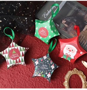 Detailed view of star-shaped Christmas gift boxes with ribbons and holiday patterns