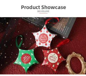 Star-shaped Christmas gift boxes with Merry Christmas prints and satin ribbons in macro detail
