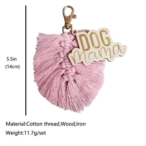 Handmade pink cotton tassel keychain with wood Dog Mama tag and golden hook clasp
