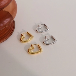 Minimalist hollow heart shaped hoop earrings in gold and silver finish for women