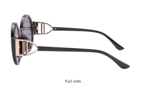 Detail view of round sunglasses featuring rose gold hollowed metal temples and geometric design