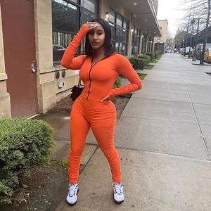 Orange long sleeve slim fit jumpsuit with front zipper and stylish ruched texture