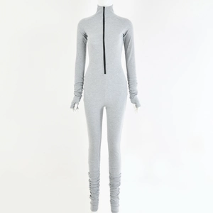 Detail of grey slim fit bodysuit with front zipper, thumbhole cuffs, and stacked legs