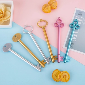 Creative key-shaped 0.5mm gel pens in assorted metallic colors on a pastel background