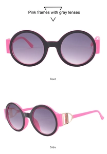Detail of pink round sunglasses with black contrast frame and golden D-shape metal hinge