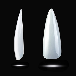 Macro view of white translucent stiletto false nails with glossy finish on black background