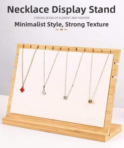 Bamboo wood necklace display stand with white panel and multiple slots for jewelry