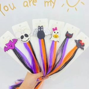 Close-up of 6-piece Halloween hair clips with purple and orange gradient synthetic hair