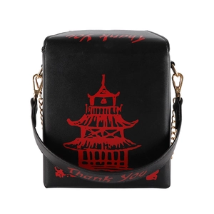 Detail of black crossbody bag with red Chinese tower print and golden chain hardware