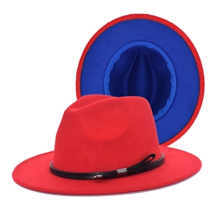 Detail of red fedora hat with black leather strap and contrast blue underbrim wool felt