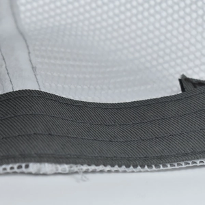 Detailed close-up of cotton sweatband and breathable mesh on baseball cap