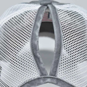 Detail of grey and white mesh ponytail baseball cap featuring functional rear opening