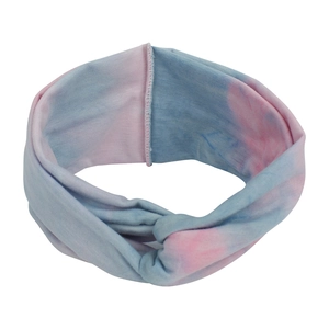 Detail of pink and blue tie-dye stretch headband with a stylish front cross knot design
