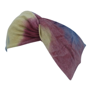 Detail of twisted wide tie-dye headband with vibrant yellow, pink and blue color gradient