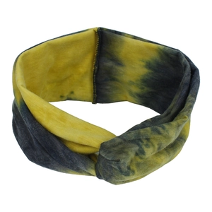 Macro detail of elastic tie-dye yoga headband showing crossover knot and knit fabric texture