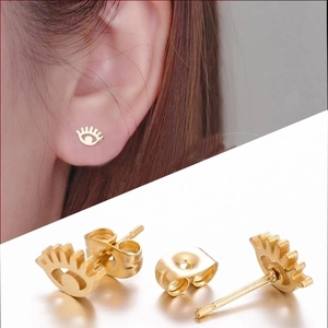 Golden evil eye stud earrings with detailed eyelashes in high-quality stainless steel