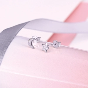 Elegant S925 sterling silver star and moon stud earrings with sparkling gemstones