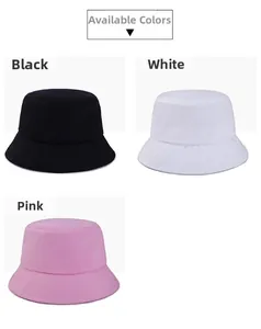 Close-up of three solid color bucket hats in black white and pink with reinforced stitching