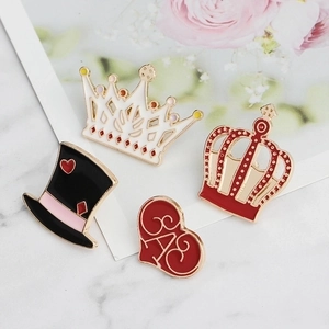 Enamel crown and heart brooch set featuring black top hat on marble and floral background