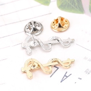 Caduceus medical symbol lapel pins in gold and silver finish with metal butterfly clutch